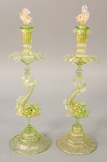 Pair of large Venetian figural glass candlesticks having green glass with gilt flecking, dolphin supports and dolphin finial stopper...