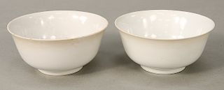 Pair white (Blanc de Chine) bowls, China, 18th/19th century, classic shape with sloping sides rising to everted rims and raised on s...