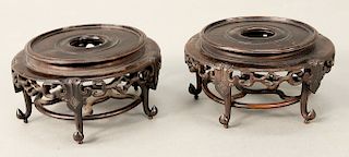 Pair of teakwood footed bases/stands, China probably 19th.  dia. 3 1/2 in. & 3 in.  Provenance: Estate of Kenneth Jay Lane