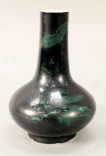 Mirror black and green dragon globular vase, China, 18th/19th century, the dragon slithering in and out of view against the black sk...