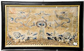 Large framed embroidered textile depicting two opposing five-clawed dragons writhing and vying for the sa...