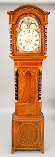 Mahogany tall clock having tombstone moon phase dial, marked: John Woolrich Wolverhampton with turned columns and brass capitals, in...