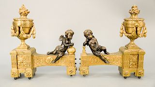 Pair of 19th Century bronze chenets with putti figures, one with anvil and a hammer the other holding a helmet; the tools for Roman God of the Fo...