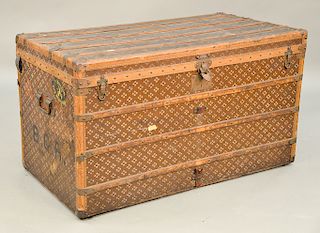 Avoc Etats Unis trunk with quilted interior cover and two trays, brass hardware, and handles.  ht. 26 1/2 in., top: 25" x 47 1/2"