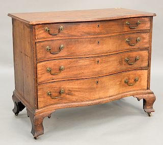 Chippendale mahogany serpentine front chest having four graduated drawers on large ogee feet.  ht. without casters 32 1/2 in., wd....