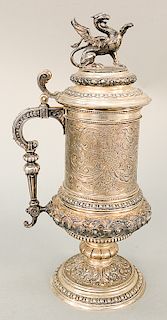 Continental silver tankard with winged griffin finial, chased and embossed body on round base, with touch mark.  ht. 15 1/2 in.,  55.5 t oz.