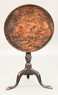 Mahogany tip table with round molded edge top on spiral turned shaft, set on tripod base, circa 1800.  ht. 28 in., 23 3/4" x 24 1/4"