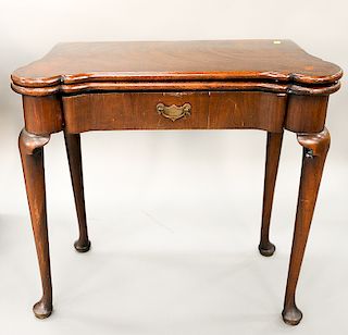 George II mahogany game table with turret corners and drawer on turned legs, ending in pad feet, circa 1750.  ht. 28 in., wd. 30 in.