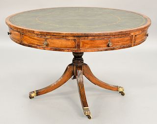 George III mahogany drum table with tooled leather green top and four drawers on quad base.  ht. 29 in., dia. 47 in.