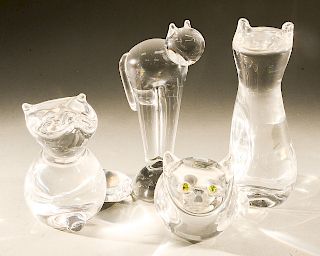 Four Steuben glass animals/cats including Fraidy Cat on ball, tall glass cat, glass cat with green eyes, and a fox, all signed on bo...