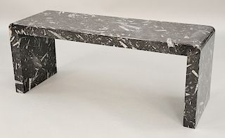 Black Fossil marble bench, having orthoceras specimens, possibly Moroccan.  ht. 19 in., top: 16" x 47"  Provenance: Estate from...