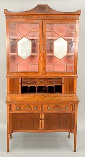 Federal mahogany secretary desk in two parts, upper portion having two glazed doors with center mirror over tambour door with drawer...