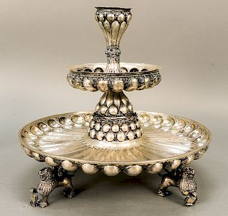 Continental silver two tier centerpiece supported by four foo style dogs with scrolls, marked 13.  ht. 17 1/2 in., dia. 19 in., 11...