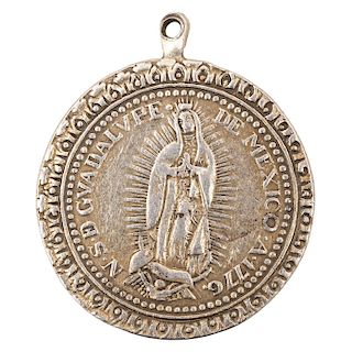 A SILVER MEDAL OF OUR LADY OF GUADALUPE. MEXICO, 18TH CENTURY.