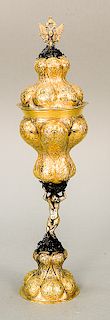 Gilt silver covered chalice having Imperial style eagle finial,  lobbed and chased body and stem with male figure on lobbed round...