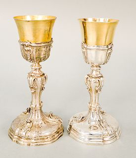 Pair of Continental silver chalice, having gilt decorated cups (one cup base slightly pushed in).  ht. 10 1/8 in. & ht. 10 1/4 in....