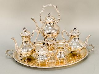 Six piece sterling tea and coffee set including tilting pot, tea pot, coffee pot, sugar, creamer, and large tray, German marked 925....