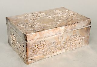 Japanese silver box with repousse chrysanthemums and hinged lid with wood interior.  ht. 4 in., top: 7 1/4" x 11"  Provenance: P...