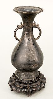 Bronze pear-shaped vase (Yuhuchunping), China, Yuan or Ming 14th-17th century, the body with raised archaic decoration, including in...