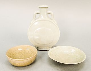 Three glazed Chinese pieces to include a celadon glazed Zhuge bowl with incised decoration, a celadon carved and incised bowl, and a...