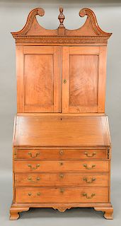 Chippendale walnut secretary desk in two parts, upper portion with broken arch top with blind carving over two doors on lower sectio...