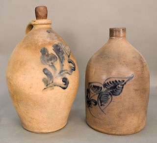 Two Stoneware jugs, each with blue decoration and floral designs.  ht. 15 in. and ht. 16 in.