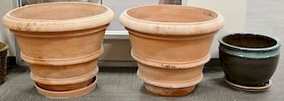 Three piece lot to include a pair of Enzo Zago terracotta Italian planters and a glazed pot. <R>planters: ht. 24 in., dia. 31 1/2 in., <R>pot: ht. 15 