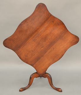 Federal cherry tip table having square serpentine edge top on urn turned shaft on tripod base with fan carved knees.  ht. 28 in.,...