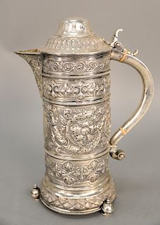 English silver ewer having overall embossed body on three round feet, having Christie's 1981 tag.  ht. 13 in.,  52 t oz.
