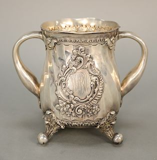 Bigelow & Kennard sterling silver two handled mug on scrolled feet, monogrammed on bottom: To Wm. S. Bennett Hopkins, Worcester Mass...