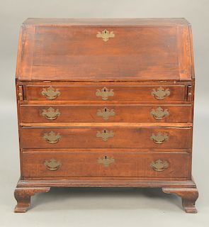 Chippendale cherry desk having slant lid over four drawers, set on ogee feet, interior with fan carved drawer, 18th century.  ht. 42 in., wd....