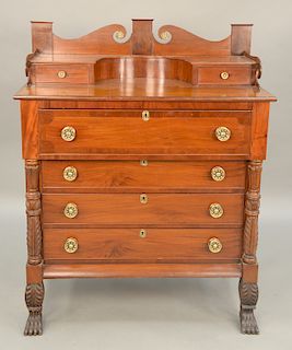 Mahogany Sheraton chest with backsplash, carved columns and paw feet, circa 1840.  ht. 55 in, wd. 41 1/2 in.