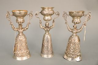 Three Continental silver wedding cups including a pair and a single, two with Christie's East 1981 tags (dents around base of pair)....