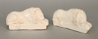 Pair of Staffordshire recumbent lion statues, white glazed.  ht. 3 in., lg. 6 in.