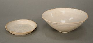 Two piece lot to include Qingbai saucer and shallow conical bowl, China, Song Dynasty (960-1279 AD/CE), the clay bodies each covered...