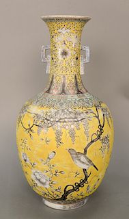 Famille Jaune and Grisaille vase, China, 20th century, the main globular body painted in monochrome grey with birds and wisteria aga...