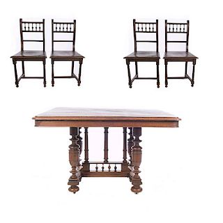 Mesa y 4 sillas. Francia. Siglo XX. Estilo Enrique II. En talla de madera de nogal. Mesa con cubierta rectangular.