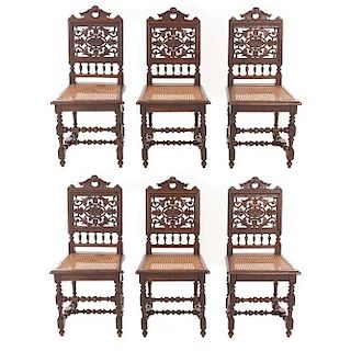 Lote de 6 sillas. Francia. Siglo XX. En talla de madera de roble. Respaldos semiabierto asientos de bejuco, fustes compuestos.