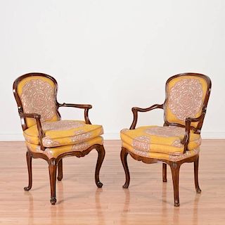 Near pair Italian Rococo carved walnut armchairs