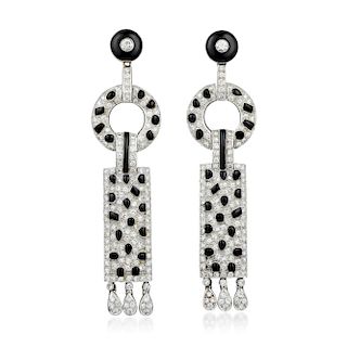 A Pair of Diamond and Onyx Earrings