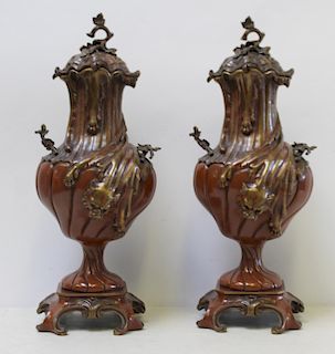 Pair of Patinated Bronze Lidded Urns.