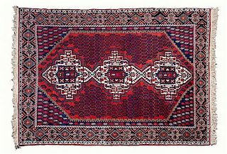 * A Persian Rug 83 1/2 x 59 1/2 inches.