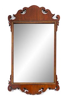 * A Chippendale Style Parcel Gilt Mahogany Tablet Mirror Height 33 1/4 x width 19 inches.