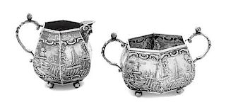 * A Dutch Silver Creamer and Sugar Set, , each decorated with nautical scenes.