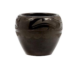 * A San Ildefonss Blackware Pottery Jar Height 4 1/2 x diameter 5 1/4 inches.