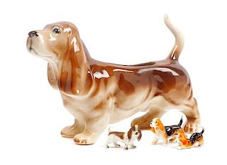 * A Group of Four Basset Hound Ceramic Figures Width of widest 11 1/2 inches.