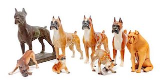 * A Group of Eight Boxer Figurines Height of tallest 9 3/4 inches.