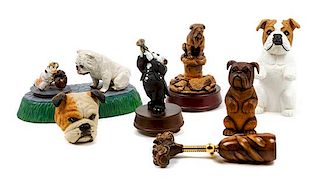 * A Group of Seven Bulldog Figures Width of widest 10 inches.