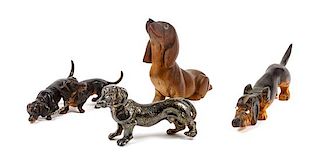 * A Group of Four Dachshund Figures Height of tallest 3 1/2 inches.