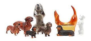 * A Group of Eight Dachshund Figures Height of tallest 8 1/4 inches.